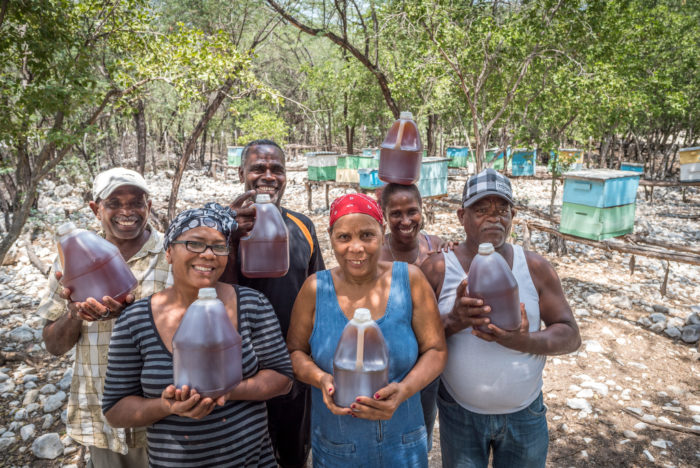 The beekeeper association is a group of 15 farmers who were looking for a way to earn extra income. World Vision gave them their first 15 hives. Now they have about 30 hives across two locations. They extract 60-70 gallons of honey each month. They sell it in markets and to wholesalers. One gallon goes for about 550 pesos (~$12). (Left to right) Jorge Marmolejo, Concepcion Reyes, Julio Montero, Maria Mateo, Araceli Castillo, and Americo Mesa. Many of their children are sponsored.